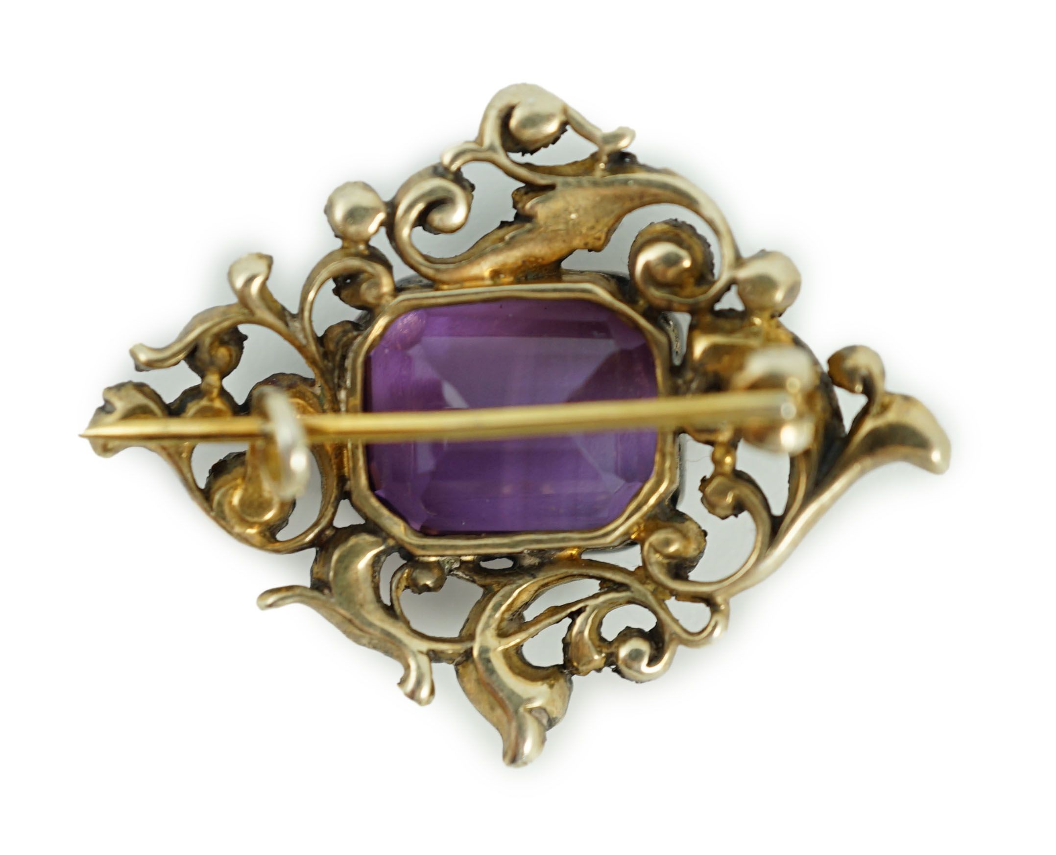 A Victorian gold and silver, emerald cut amethyst and diamond cluster set brooch